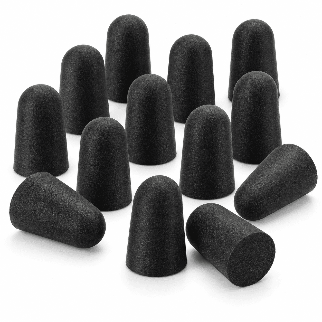 Group of black noise-reducing foam earplugs arranged on a white background